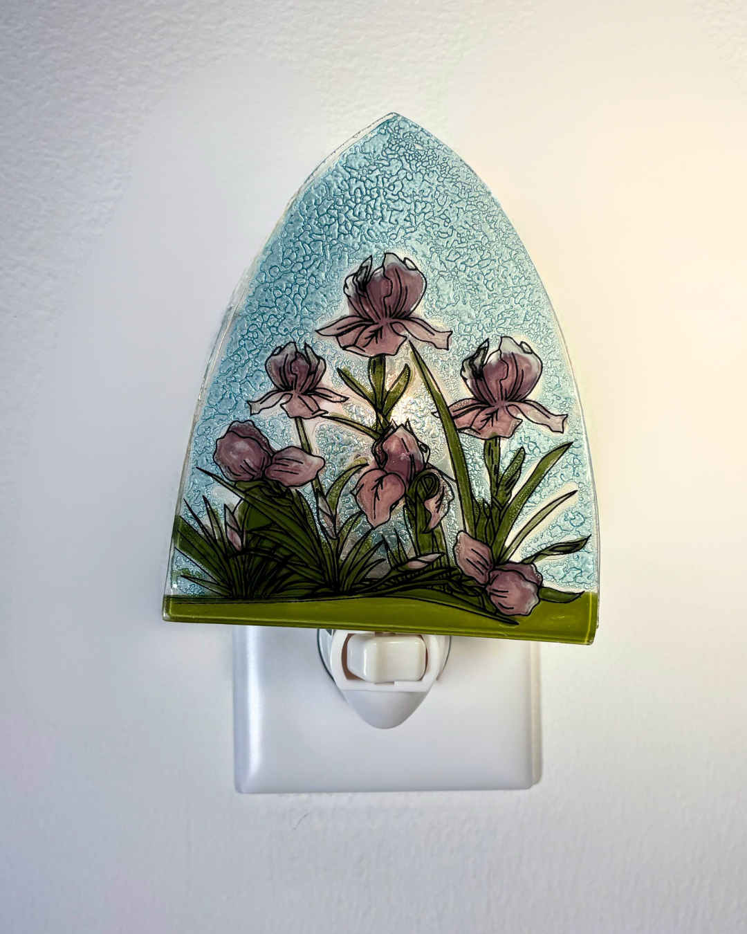 Decorative night light with floral design on a white background