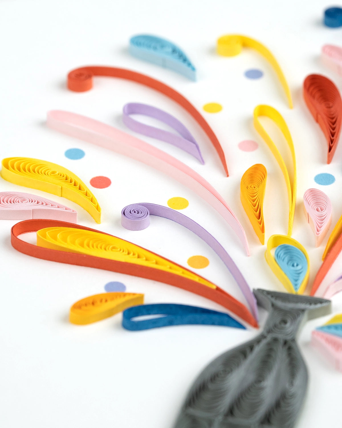 White Card with a bottle of sprays of quilling paper with congratulations below