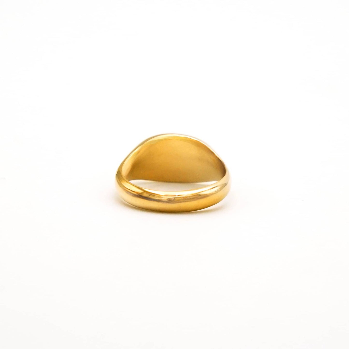 Gold ring on a white background