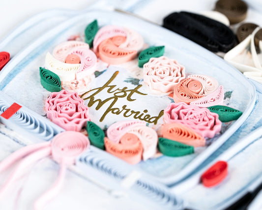 Card with a vintage car design featuring flowers and 'Just Married' text on a white background