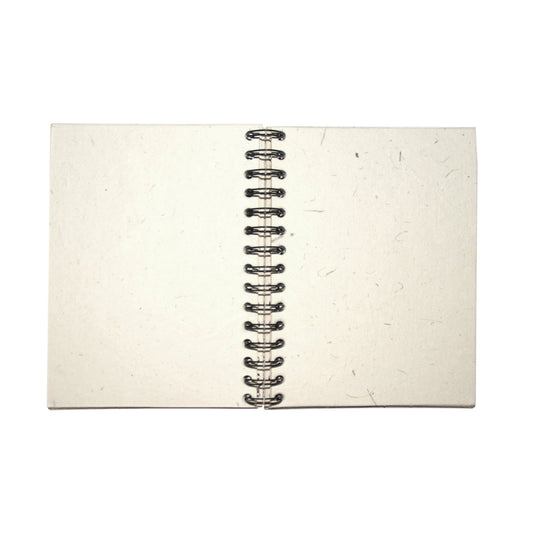 Open notebook with lightly textured pages and a black spiral binding on a white background