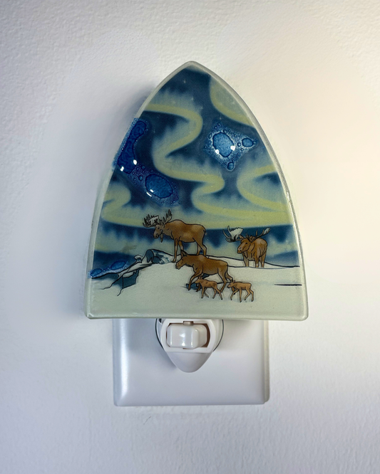 Decorative night light with a moose family design on a blue and yellow background