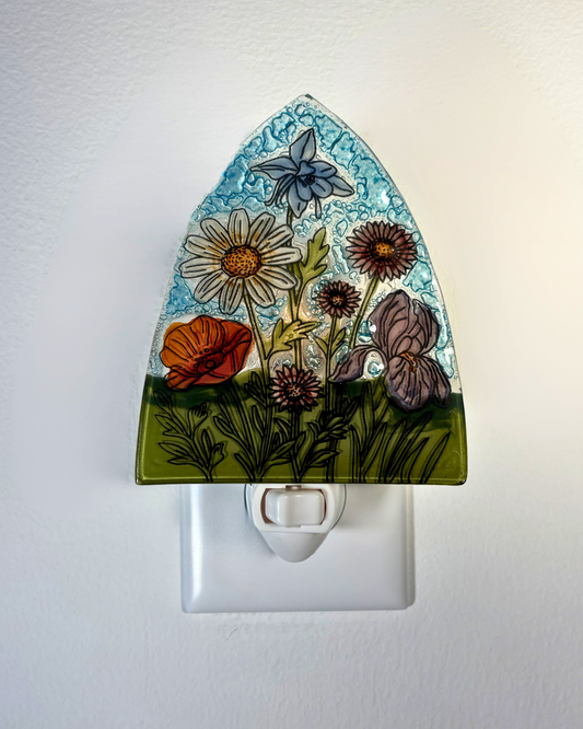 Decorative night light with floral design on a white background
