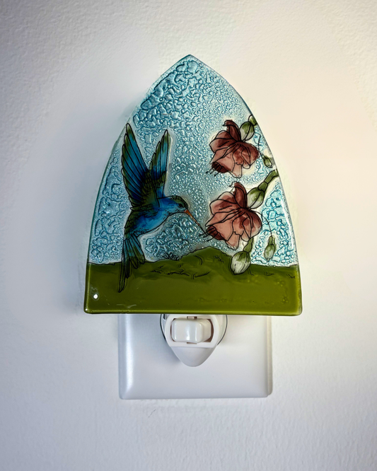Decorative night light with a hummingbird and floral design on a white background