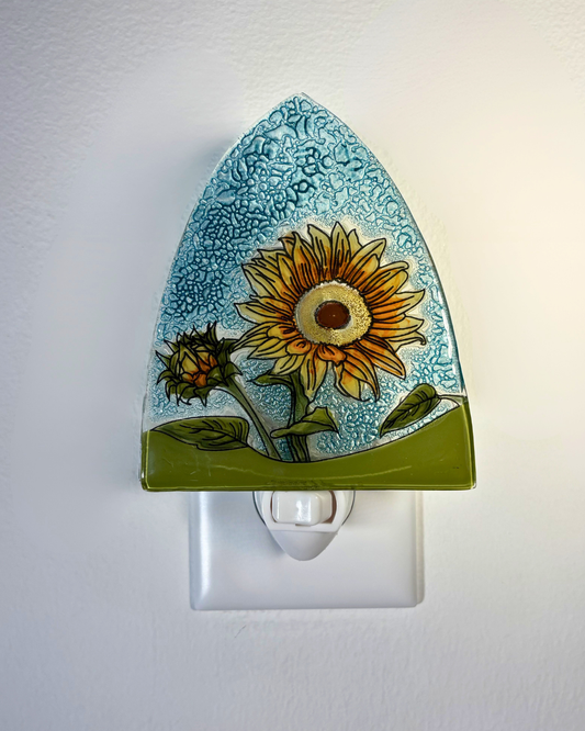 Decorative night light with sunflower design on a white background