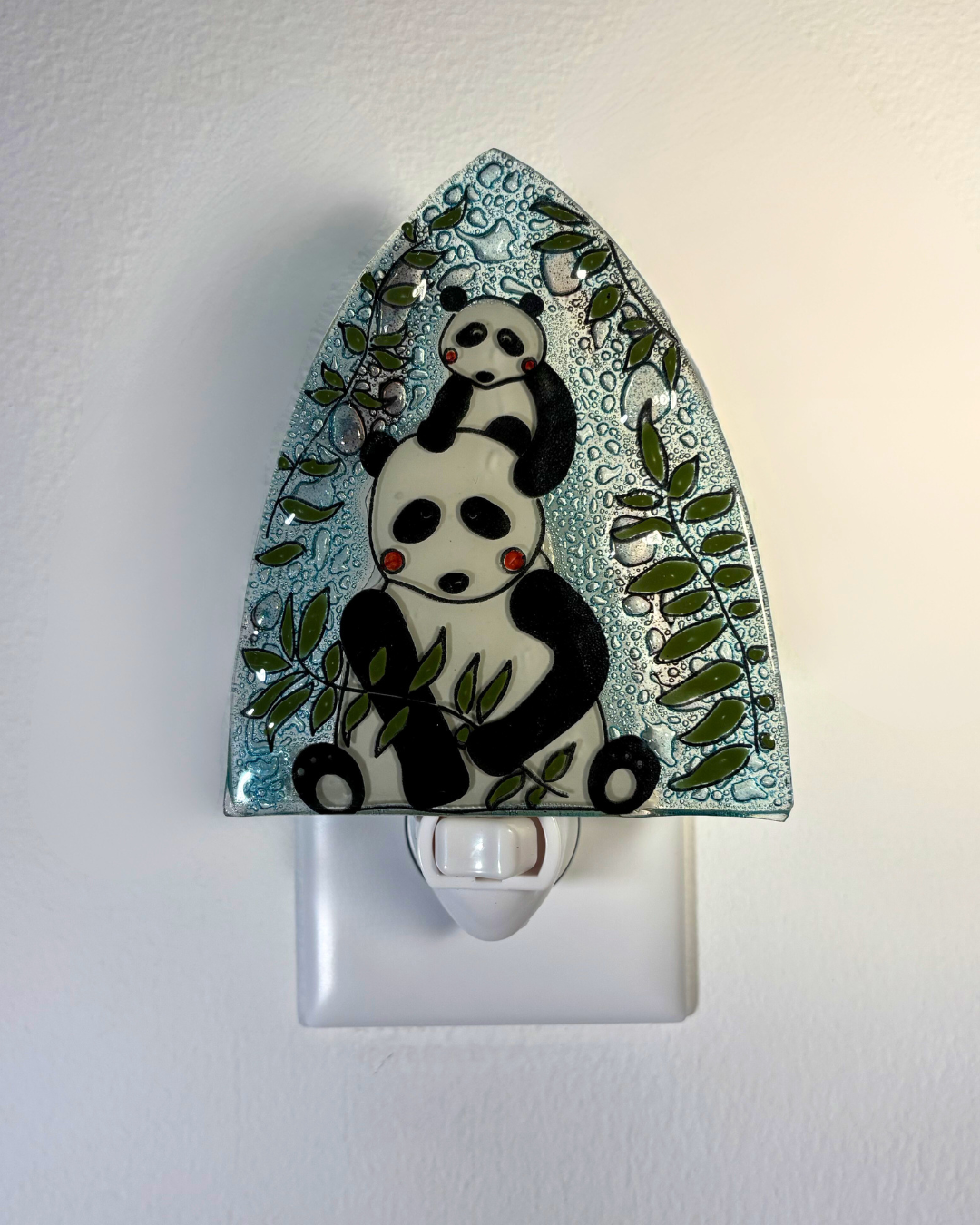Night light with panda design on a white background
