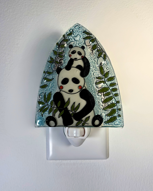 Night light with panda design on a white background