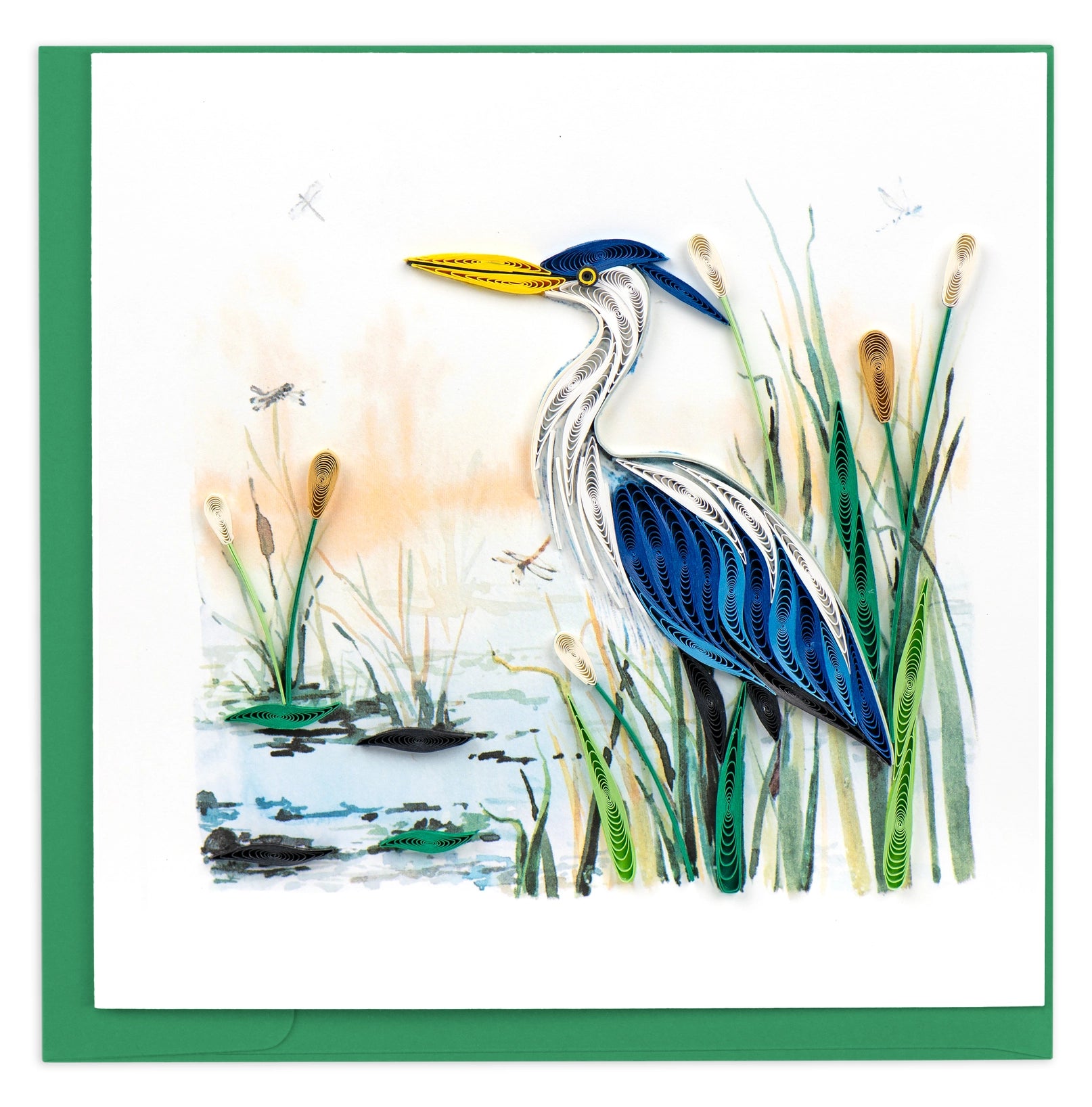 Greeting Card with a Great Blue Heron sits upon a rock along a stream surrounded lilypads and cattails.