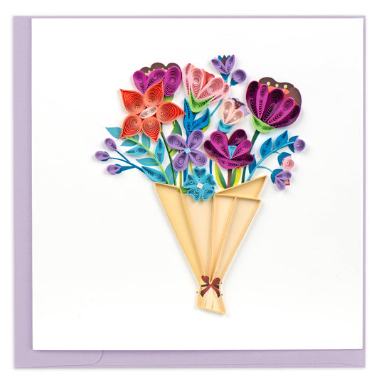 Greeting card with quilled spirals of paper in different flower shapes all wrapped in a light brown bouquet.