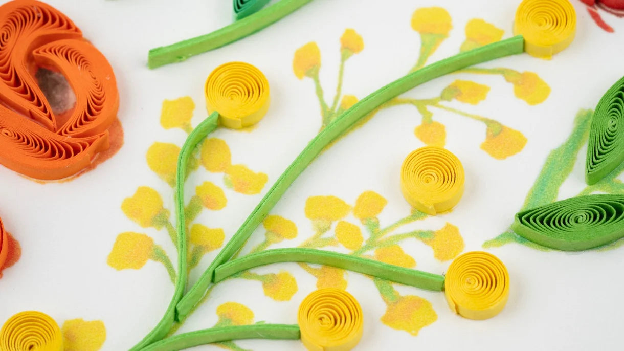 Close Up of Card with a heart-shaped arrangement of colorful flowers on a white background