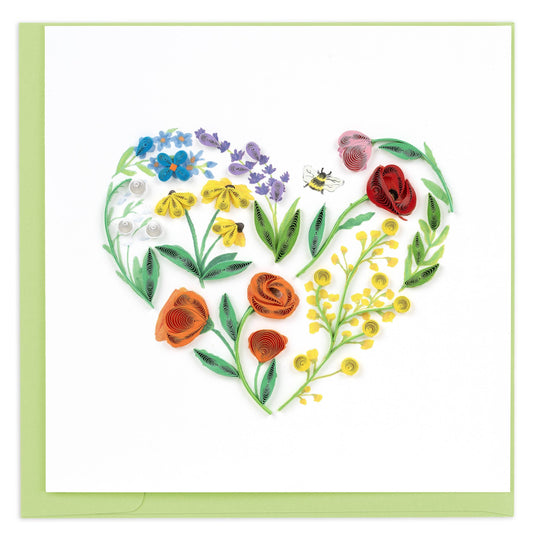Card with a heart-shaped arrangement of colorful flowers on a white background