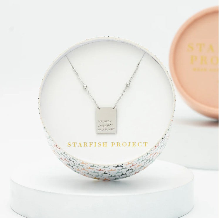 Necklace in a decorative box with 'Starfish Project' branding on a white background
