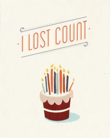 A birthday card with an illustration of a birthday cake with multiple candles and the text 'I LOST COUNT' above it.