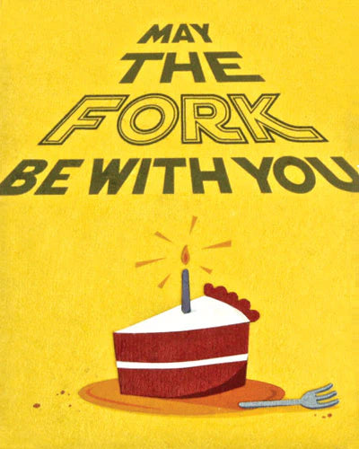 A greeting card with an illustration of a piece of cake with a candle on it, and a fork beside it, against a yellow background. The text on the card reads 'May THE FORK BE WITH YOU'.