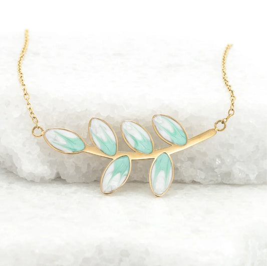 Gold necklace with mint green leaf-shaped design on a white background