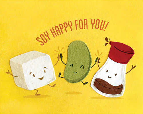 Cartoon characters of soy cubes, a pod, and a container with 'Soy Happy For You!' text on a yellow background.