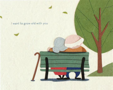 A greeting card illustration depicting an elderly couple sitting on a bench with the phrase 'I want to grow old with you' printed at the top.