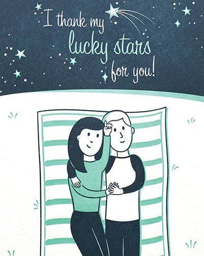 Illustration of a couple under a starry sky with text 'I thank my lucky stars for you!' on a blue background.