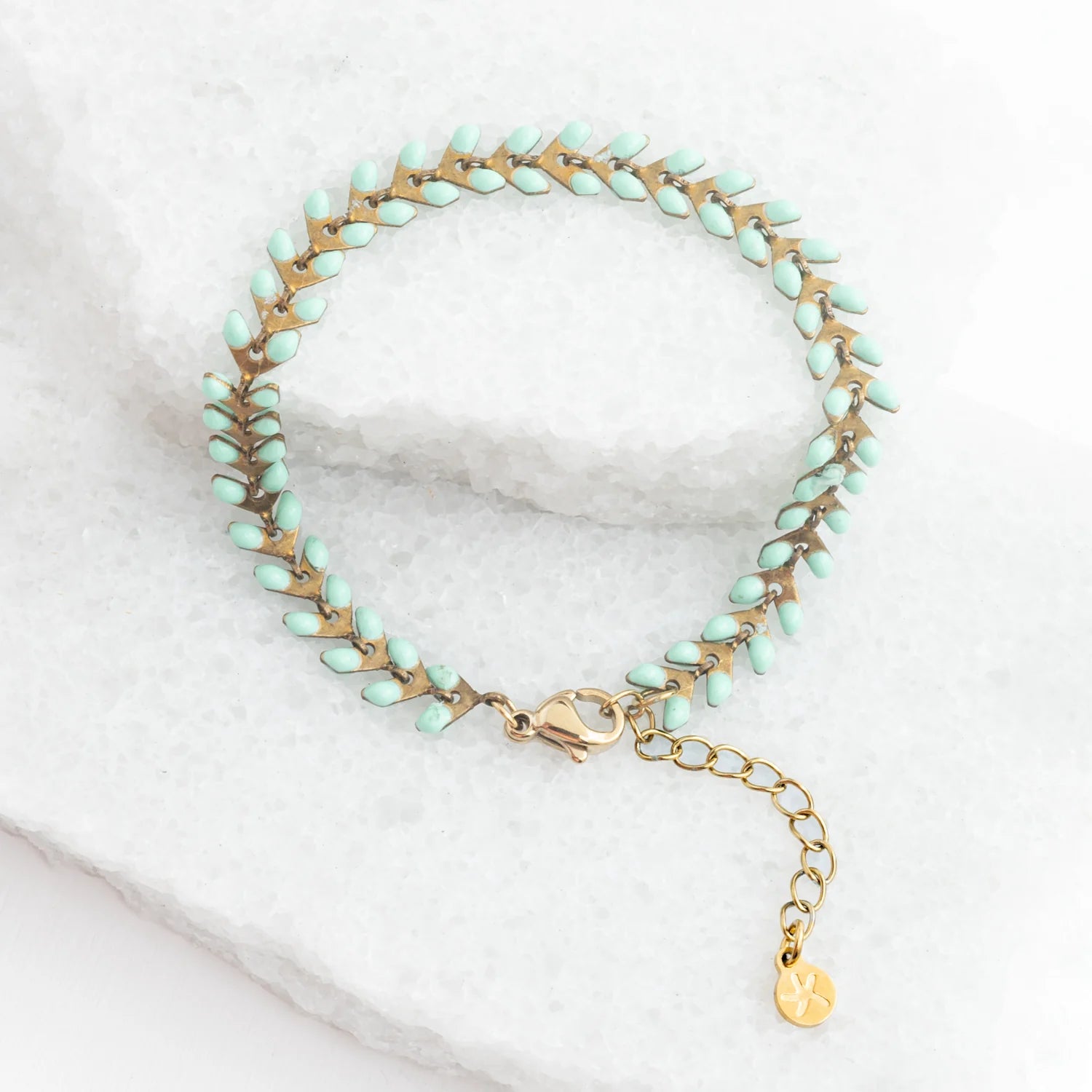 Linked bracelet with small mint enamel dots along the chain. Extra links available to extend.