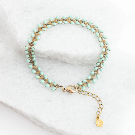 Linked bracelet with small mint enamel dots along the chain. Extra links available to extend.