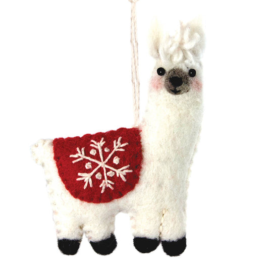A white felt llama Christmas ornament with a red felt blanket featuring a white embroidered snowflake, black felt hooves and snout, and a white hanging loop.