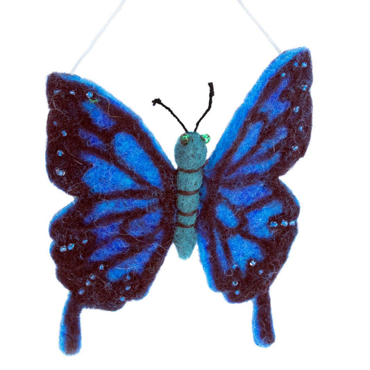 Blue and black butterfly-shaped ornament on a white background