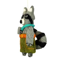 The side view of a felt raccoon hanging ornament with a teal climbing rope and green pants with orange details, isolated on a white background.