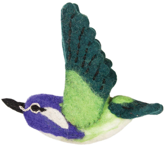Felted wool Costas hummingbird with green wings and purple body on a white background