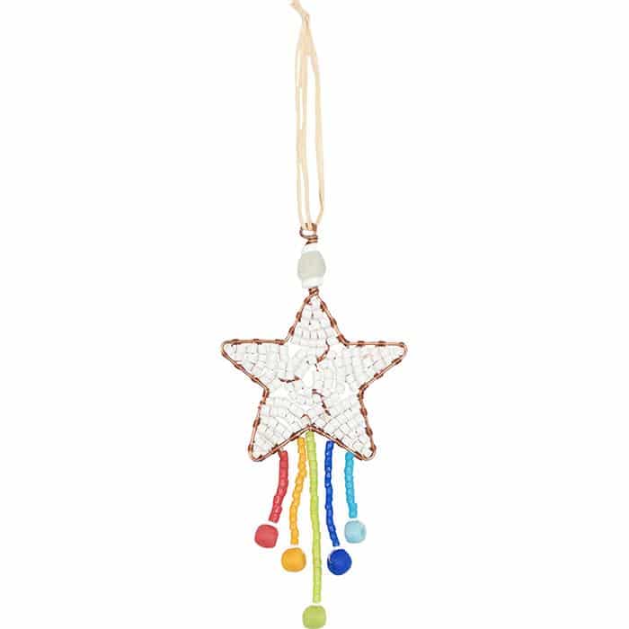A handmade star-shaped mosaic ornament hanging from a cream cord. The star is decorated with white mosaic tiles and a copper-colored border, with colorful hanging tassels in red, orange, yellow, green, blue, and light blue at the bottom.