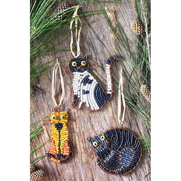 A collection of three cat ornaments made from recycled glass ornaments.