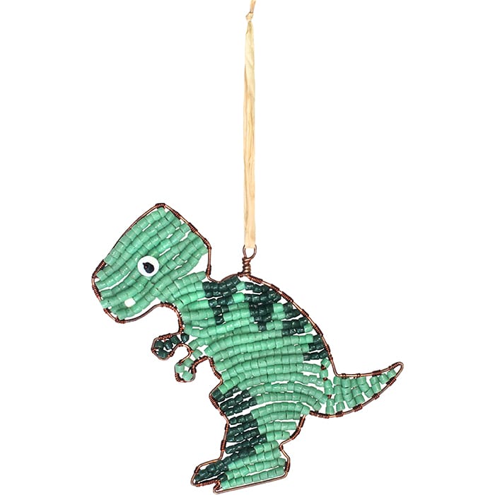A green beaded dinosaur ornament, shaped like a T-rex, hanging from a light tan string against a plain white background.