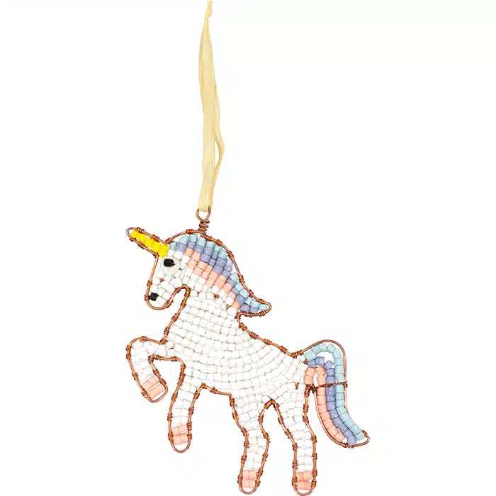 a unicorn shaped ornament hangs by a piece of raffia. The ornament is make from individual recycled glass beads intertwined with copper wire.