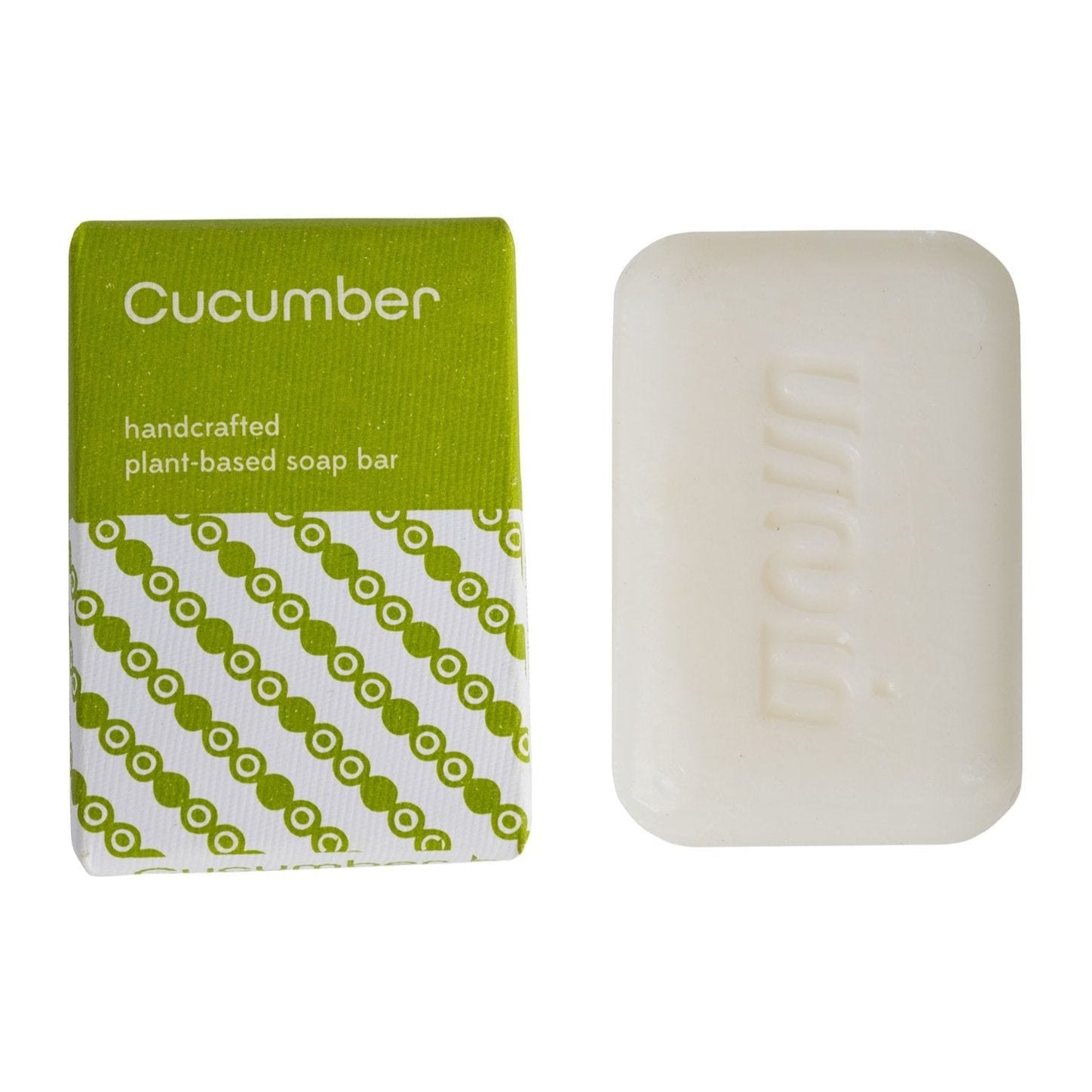 A bar of soap with a green and white label that reads 'Cucumber' and 'Handcrafted plant-based soap bar'. The packaging has a geometric pattern with green and white colors.