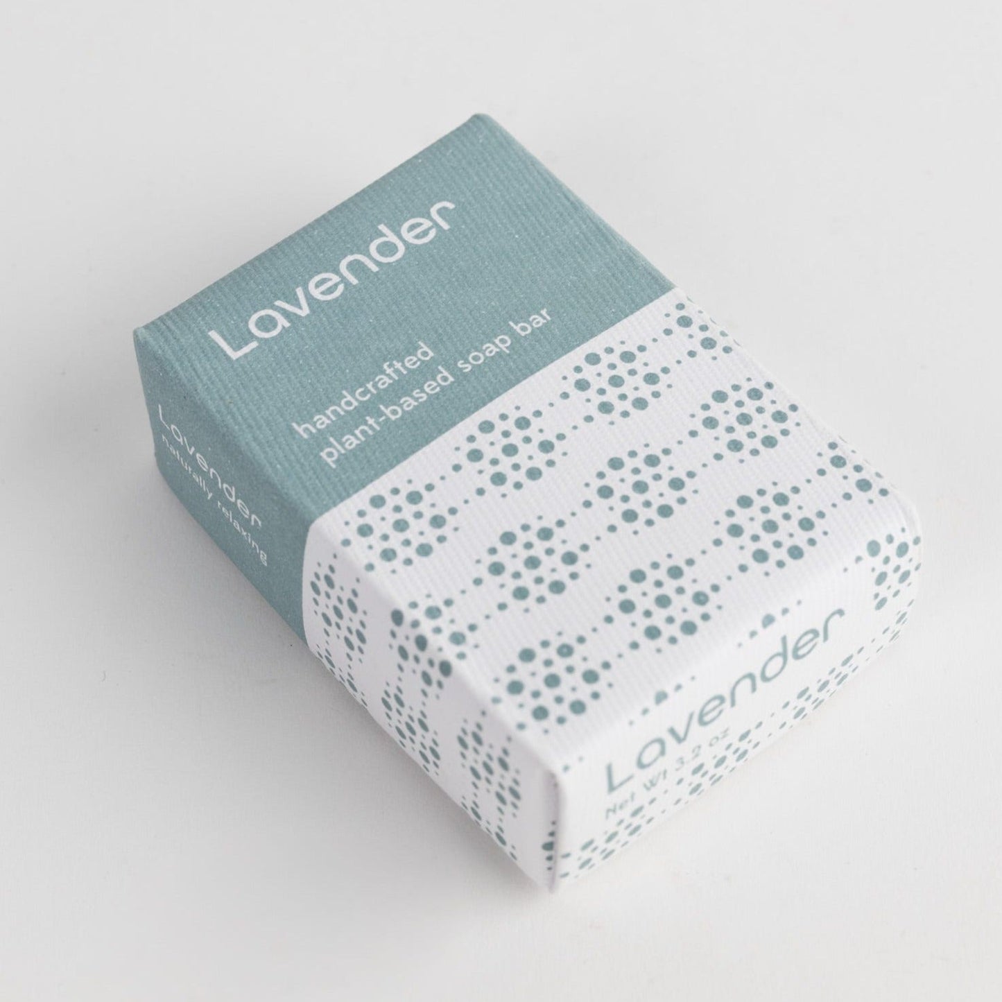 A blue and white geometric package that says "Lavender" is laid on a plain white background.
