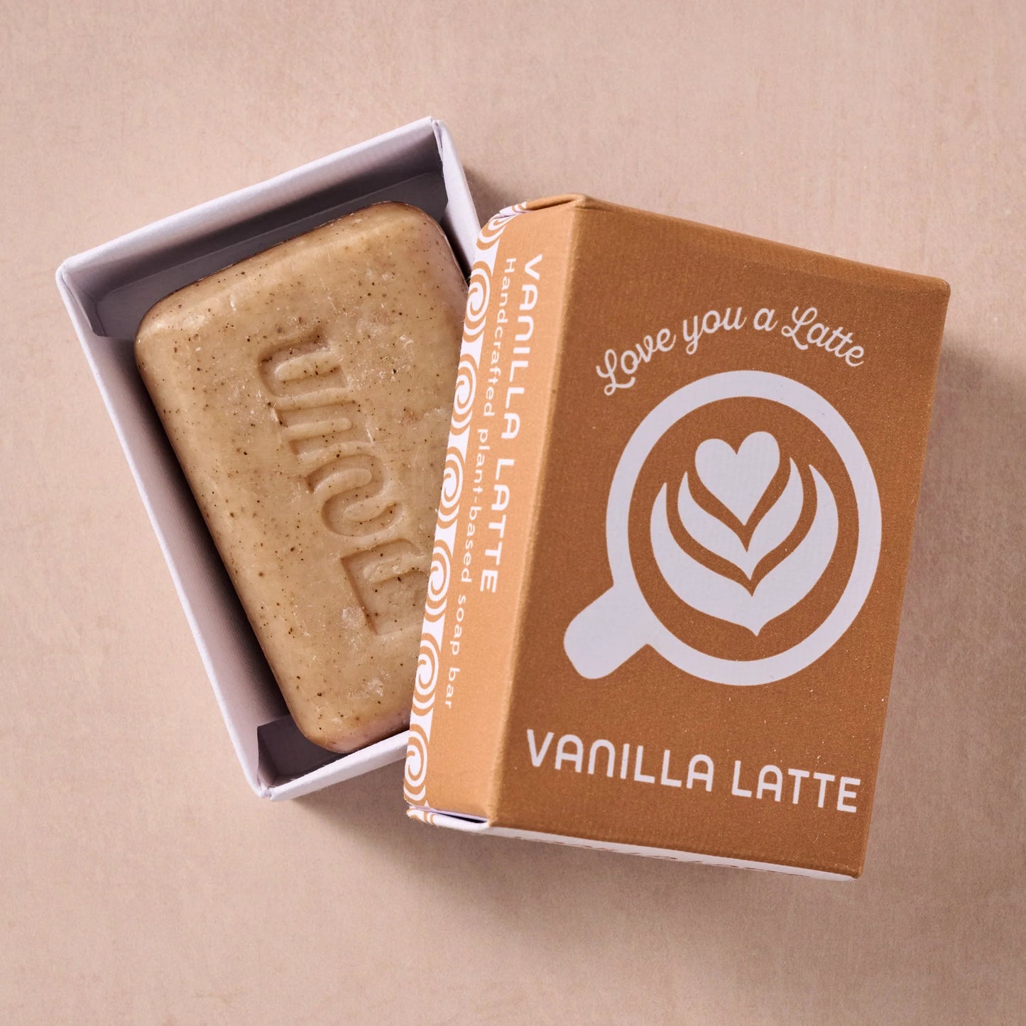 Vanilla latte soap bar in a brown box with 'Love you a Latte' branding on a beige background