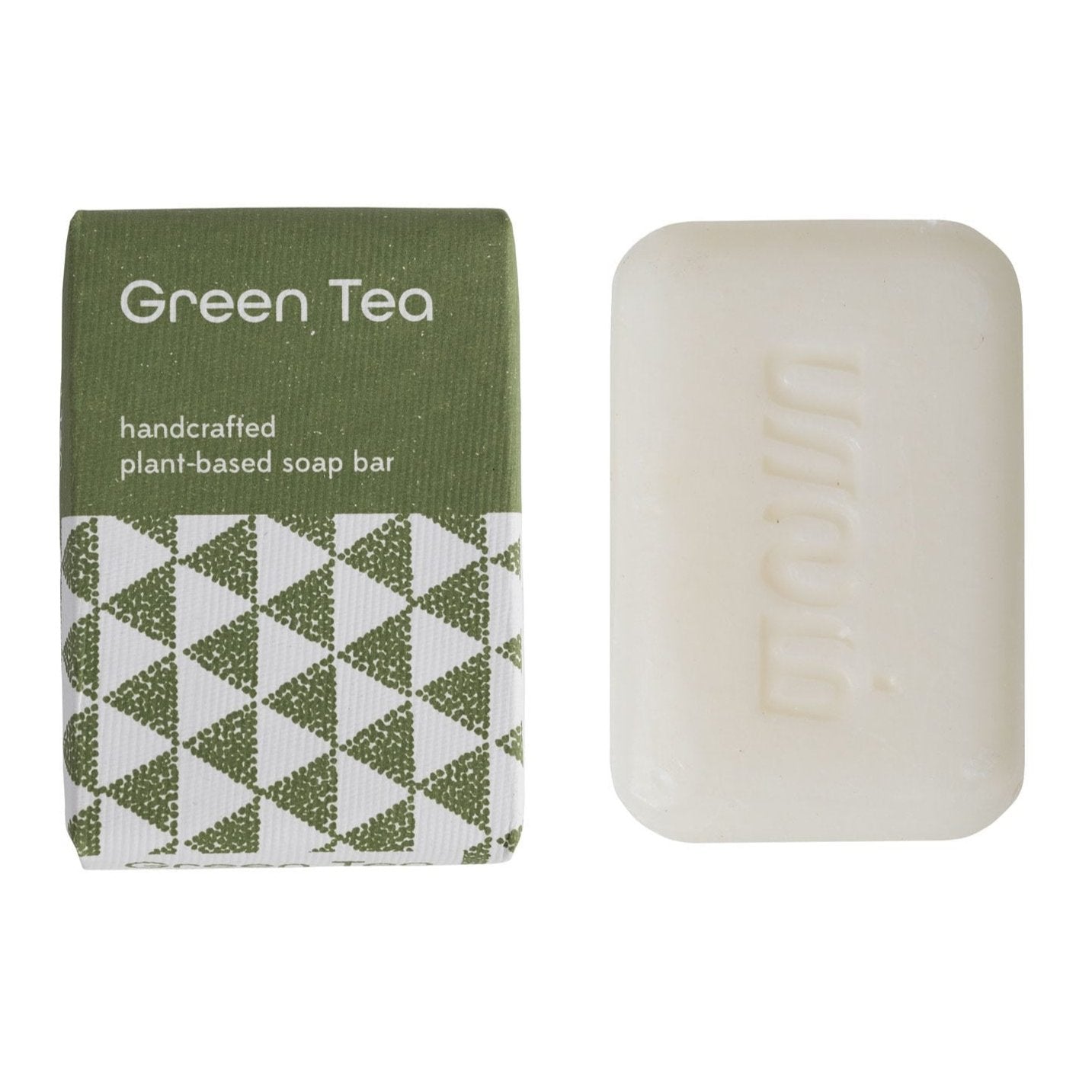 A bar of Green Tea scented, handcrafted plant-based soap and its green and white package on a white background.