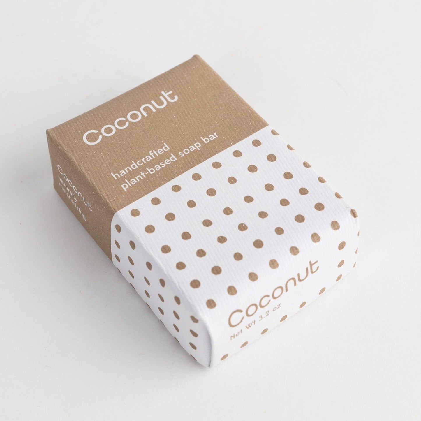 A light brown and white polka dot package on a white background.