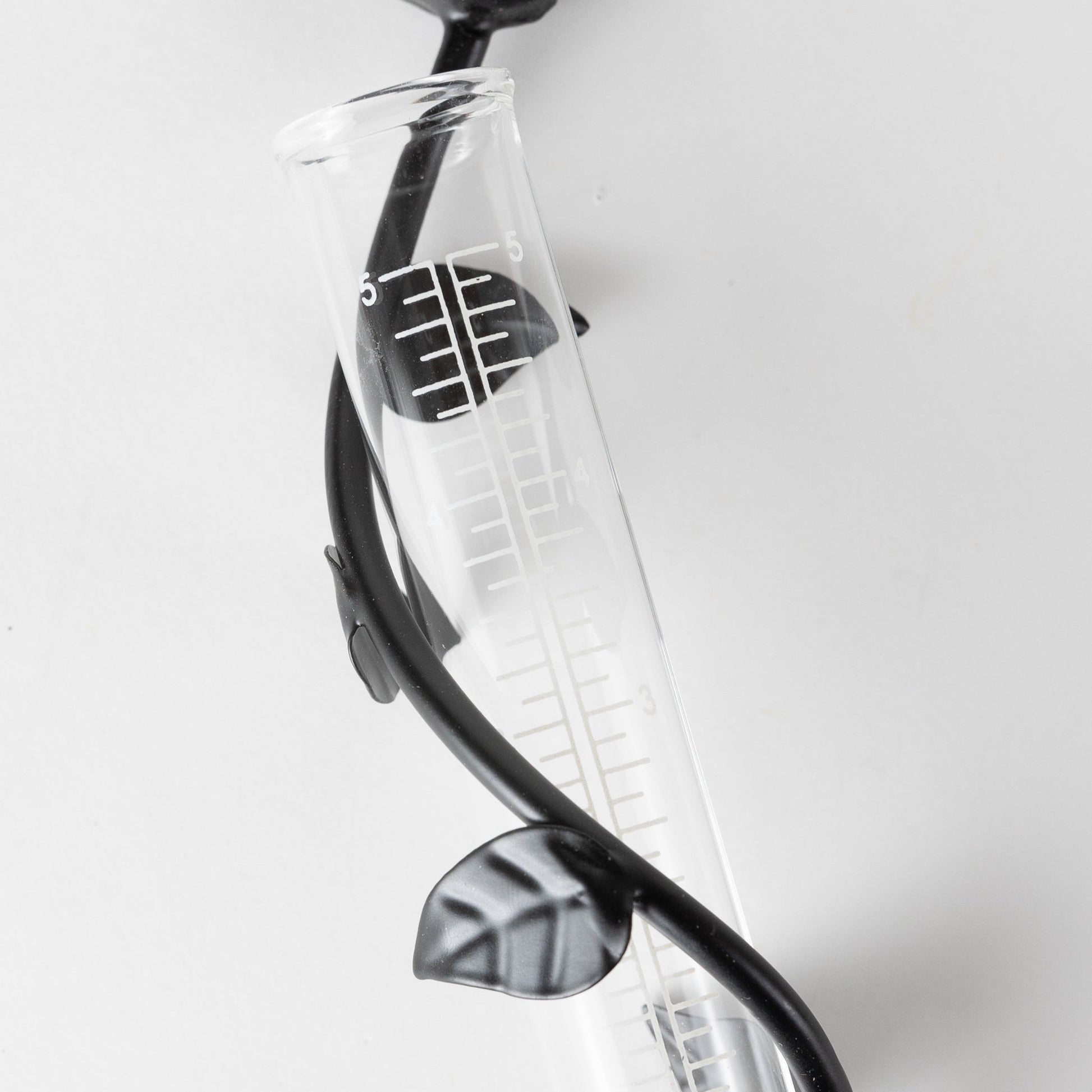 Close up of Indira Cast Iron Rain Gauge on white background