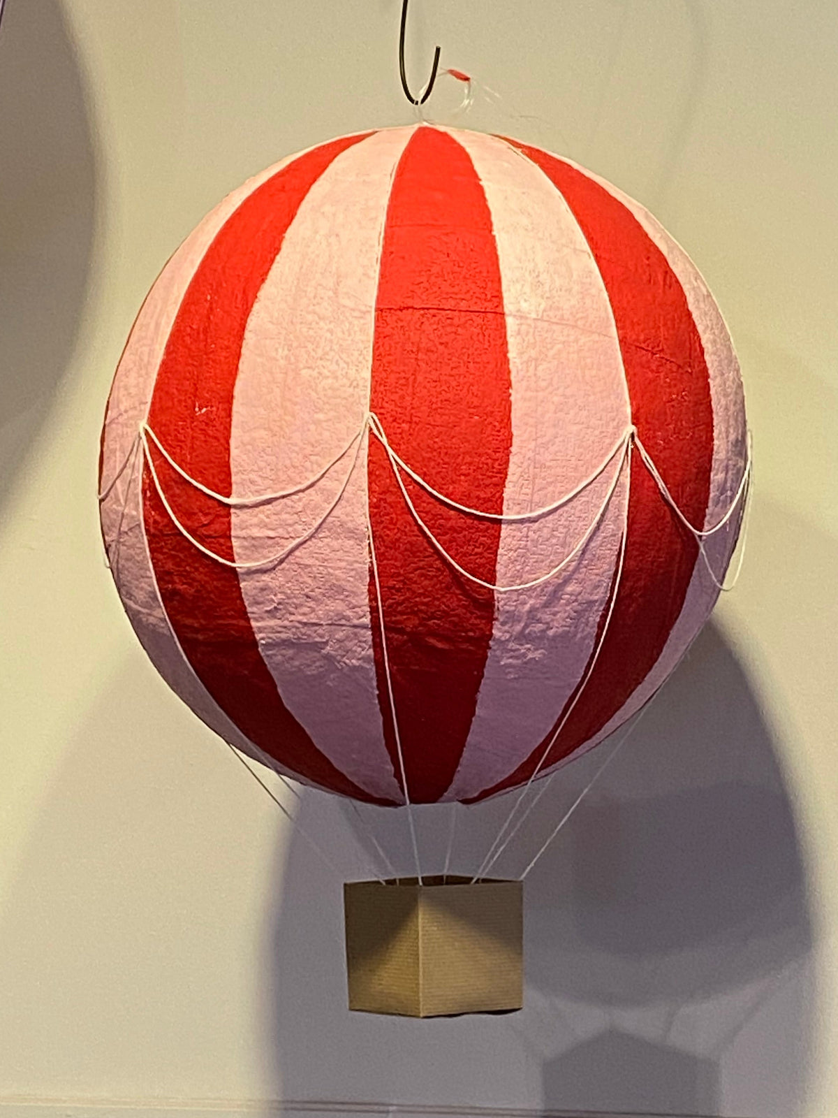 Red and pink striped plaster of paris hot air balloon.