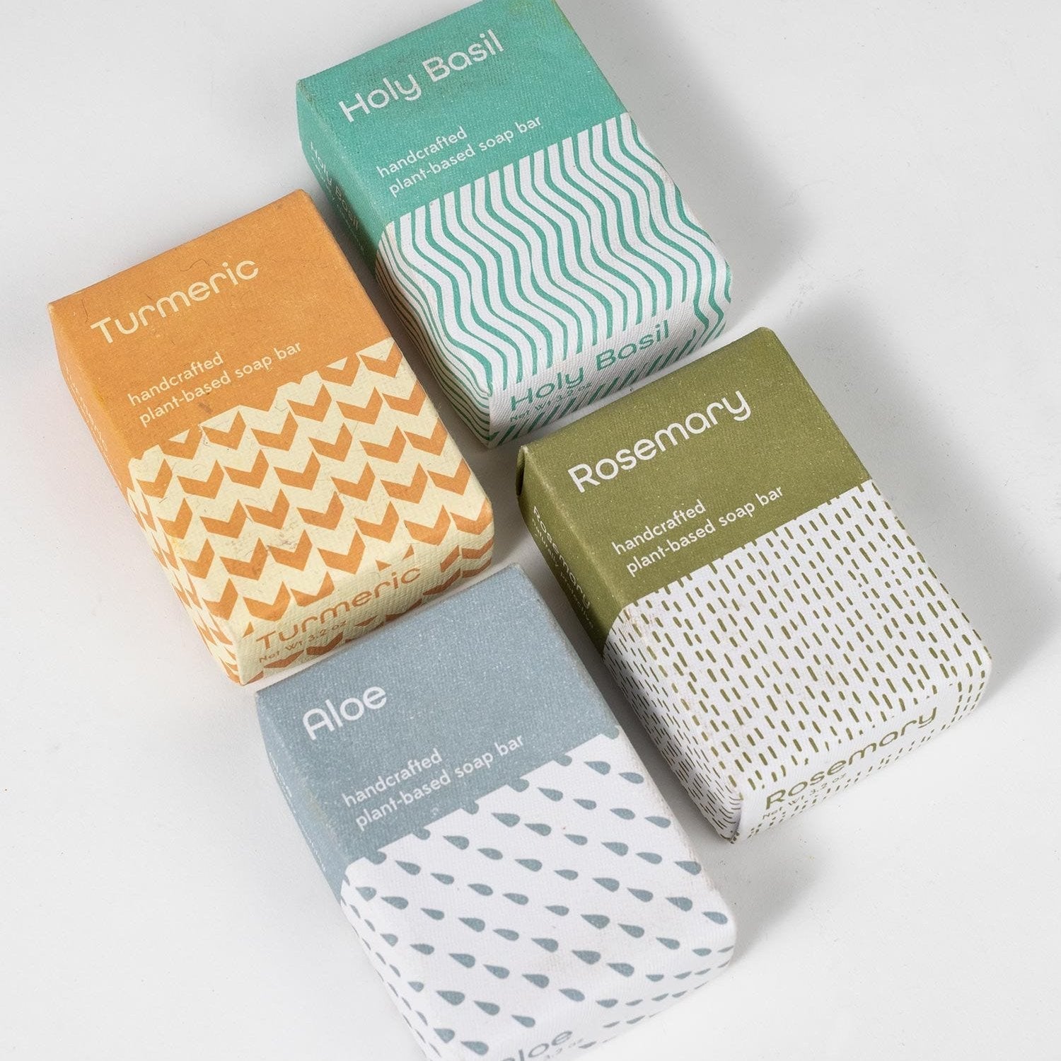 Styled shot of four bars of soap.