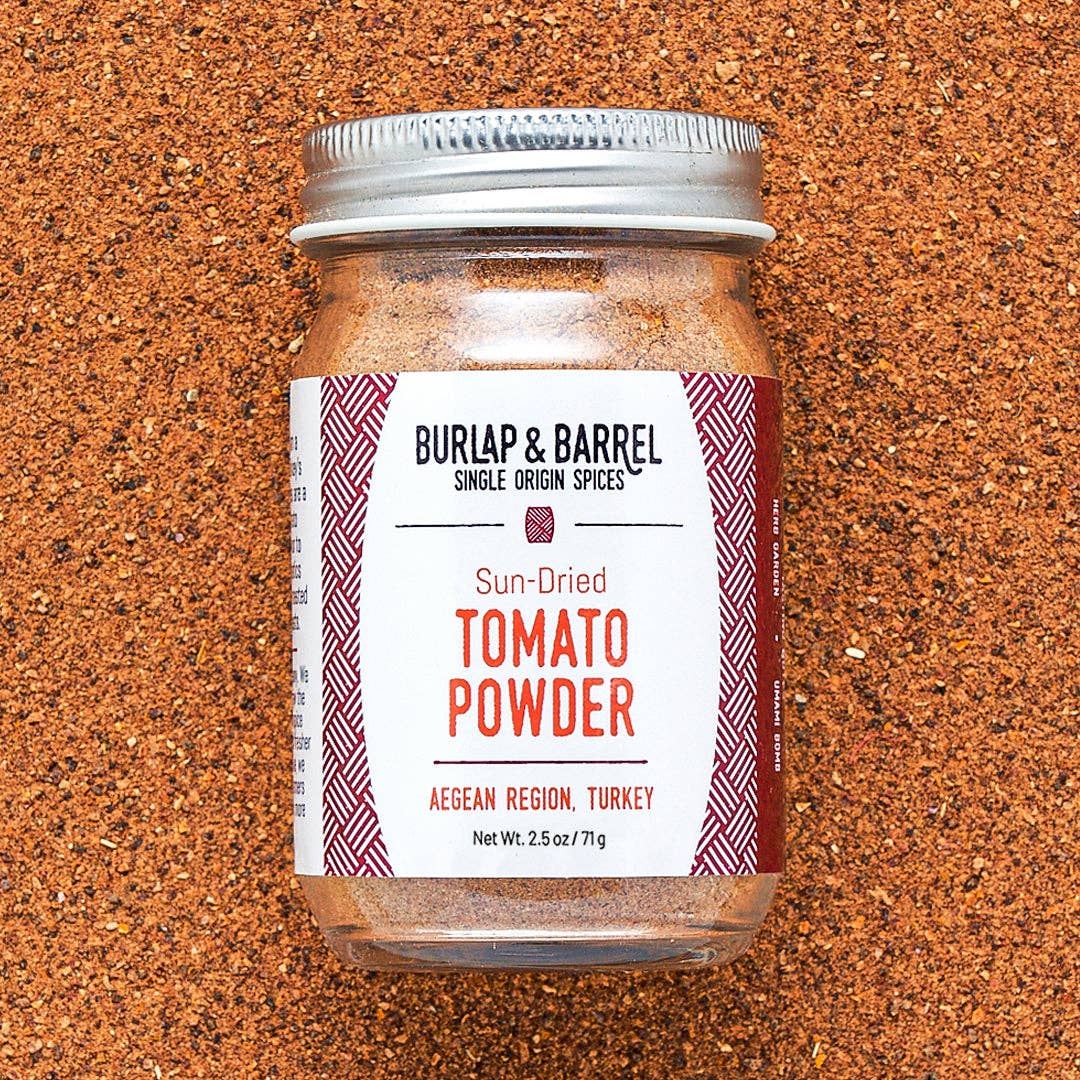 Jar of Burlap & Barrel Sun-Dried Tomato Powder on a textured brown background