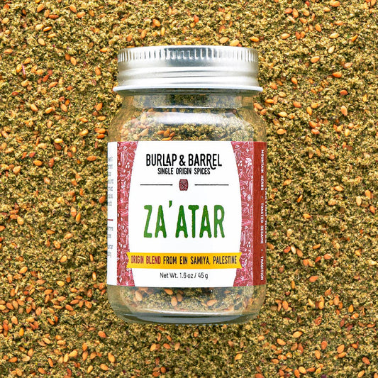 Jar of Za'atar spice blend from Burlap & Barrel on a textured spice background