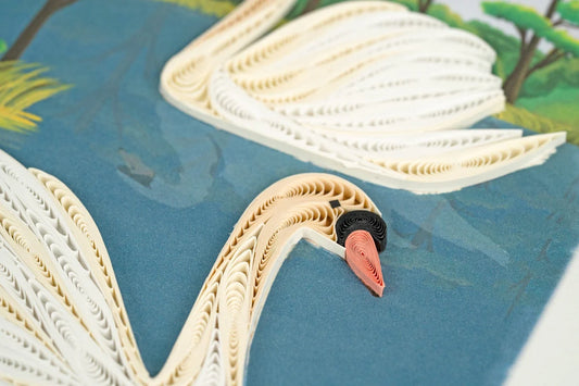 Close up of Greeting Card with two quilled swans as they float along the water.