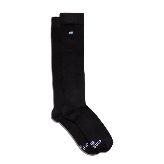 Black knee-high socks with white text on a white background