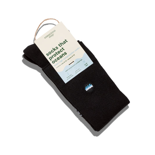 Black socks with a tag on a white background