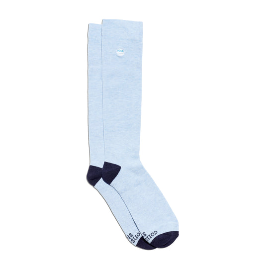 Light blue knee-high sock with navy accents on a white background