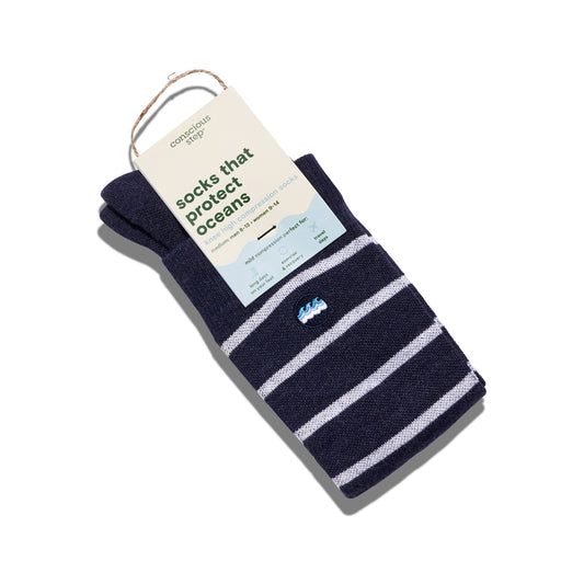 Navy striped socks with a tag on a white background