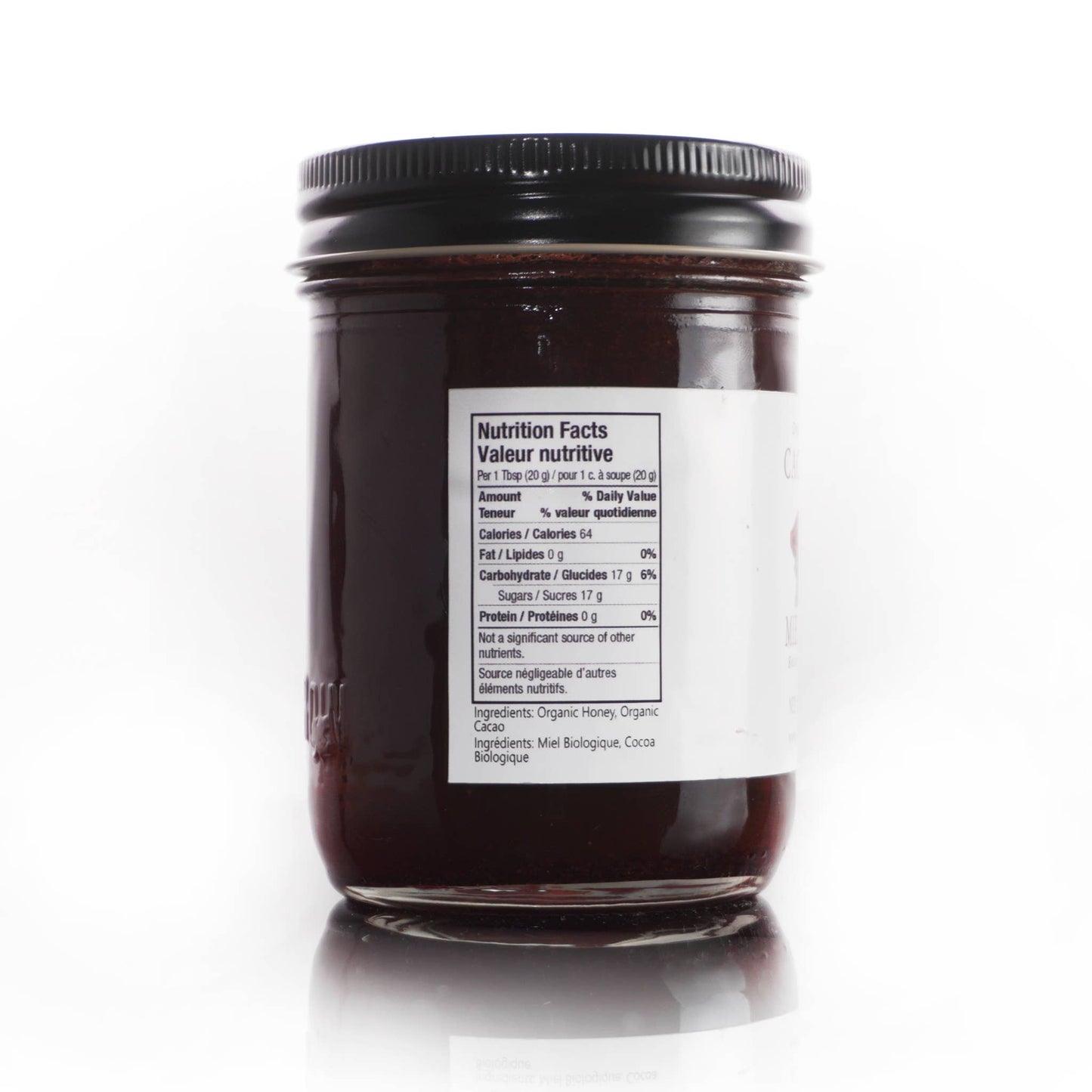 Jar of chocolate honey spread with a nutrition label on a white background