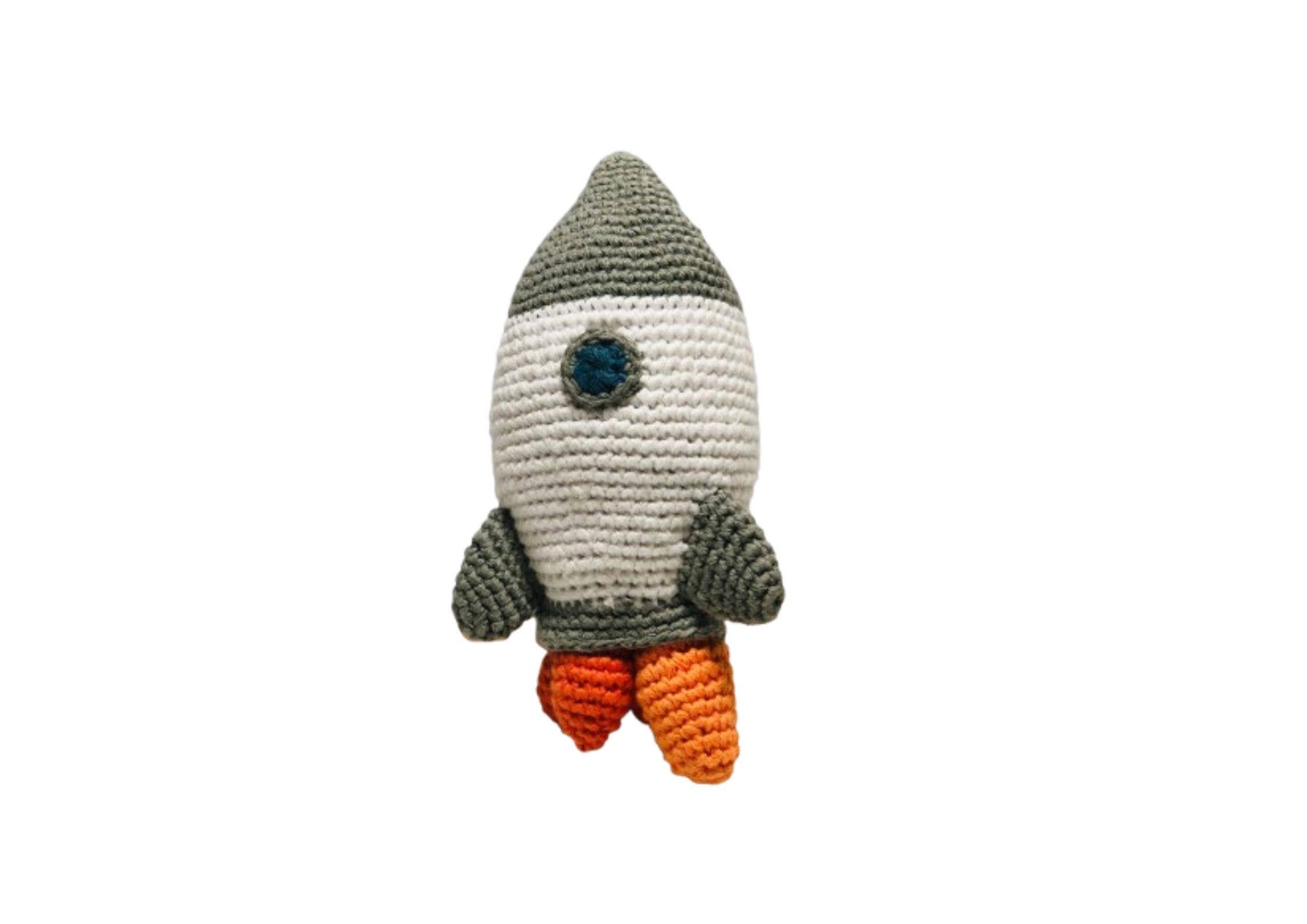 Crocheted rocket-shaped toy on a white background