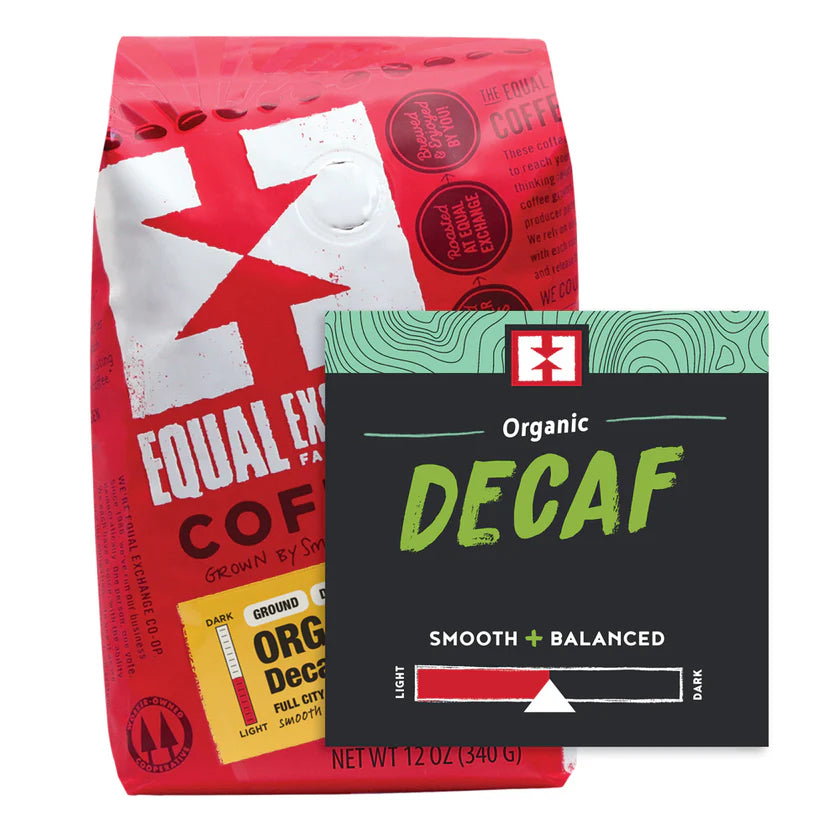 Two coffee packages: a red Equal Exchange coffee bag and a green and black Organic Decaf package.